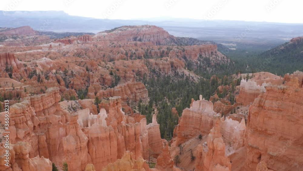Female hiker walking on trail in Bryce Canyon National Park in Utah, USA camera tilting up to amazing view of hoodoos Female hiker walking on trail in Bryce Canyon National Park in Utah, USA camera tilting up to amazing view of hoodoos