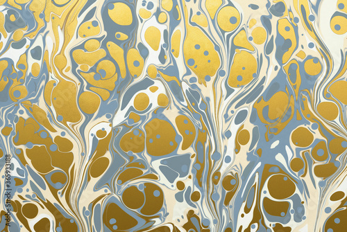 An ink marbling abstract pattern with metallic gold ink, similar to marbled ink techniques used on the inner cover linings of vintage and antiquarian books