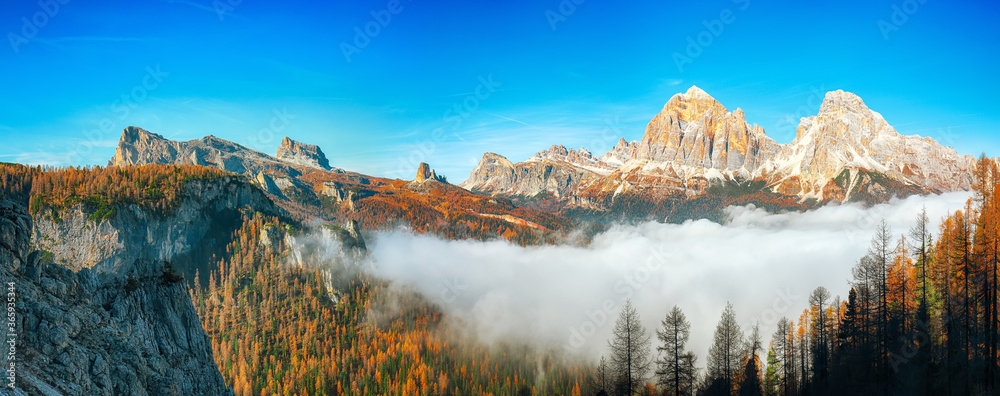 Autumn sunny landscape with View of Tofana di Rozes and Cinque Torri
