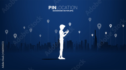 Silhouette of man with mobile and GPS icon with city background. concept of location and facility place , GPS technology