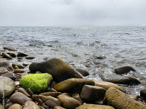 Russia, Vladivostok, Russia, Vladivostok, Bay shore of Akhlestyshev on Russkiy island  in cloudy weather  photo