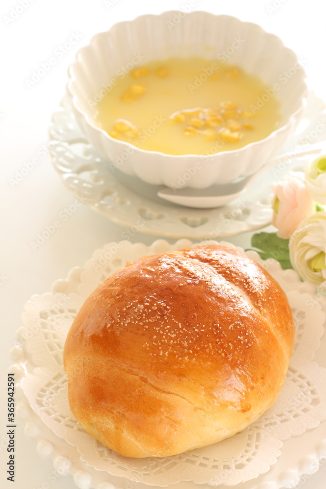 Fototapeta premium homemade butter roll on white dish with copy space