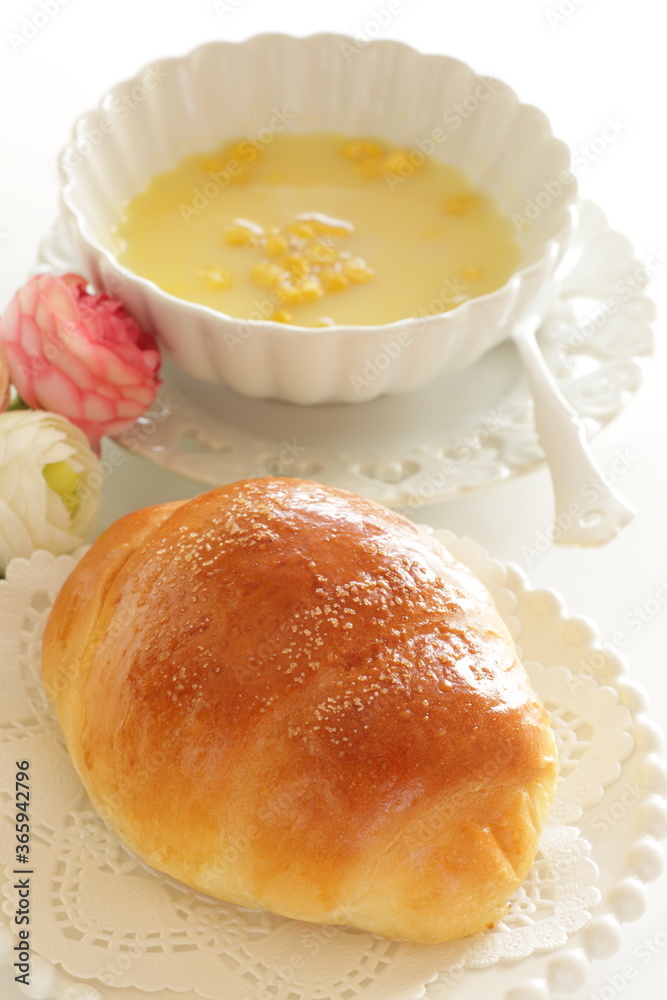 homemade butter roll on white dish with copy space homemade butter roll on white dish with copy space