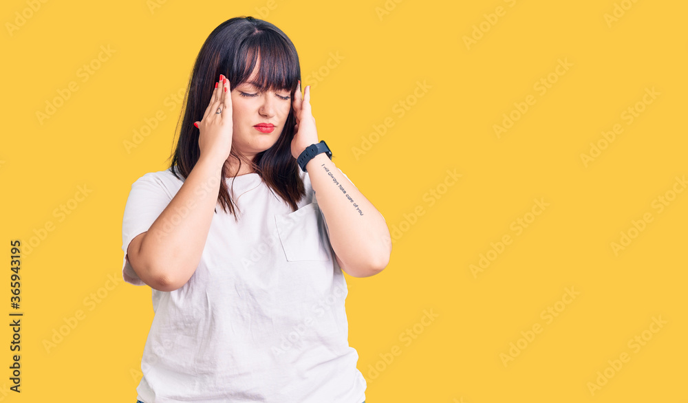 Young plus size woman wearing casual clothes with hand on head, headache because stress. suffering migraine. Young plus size woman wearing casual clothes with hand on head, headache because stress. suffering migraine.