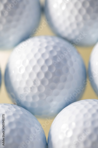 Close up macro photo with white golf balls for sports background