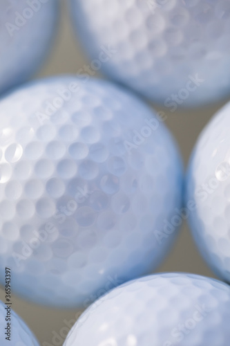Close up macro photo with white golf balls for sports background