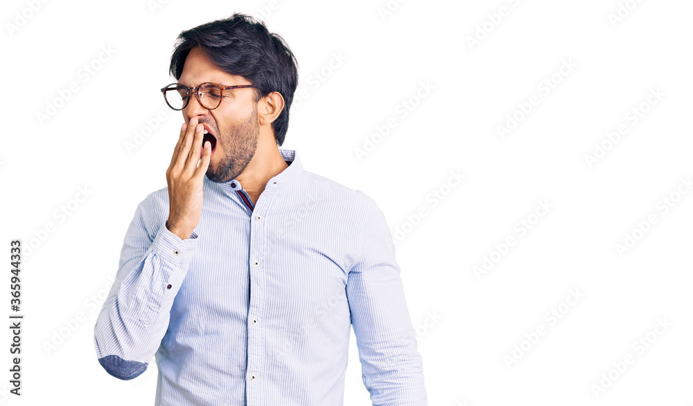 Handsome hispanic man wearing business shirt and glasses bored yawning tired covering mouth with hand. restless and sleepiness. Handsome hispanic man wearing business shirt and glasses bored yawning tired covering mouth with hand. restless and sleepiness.