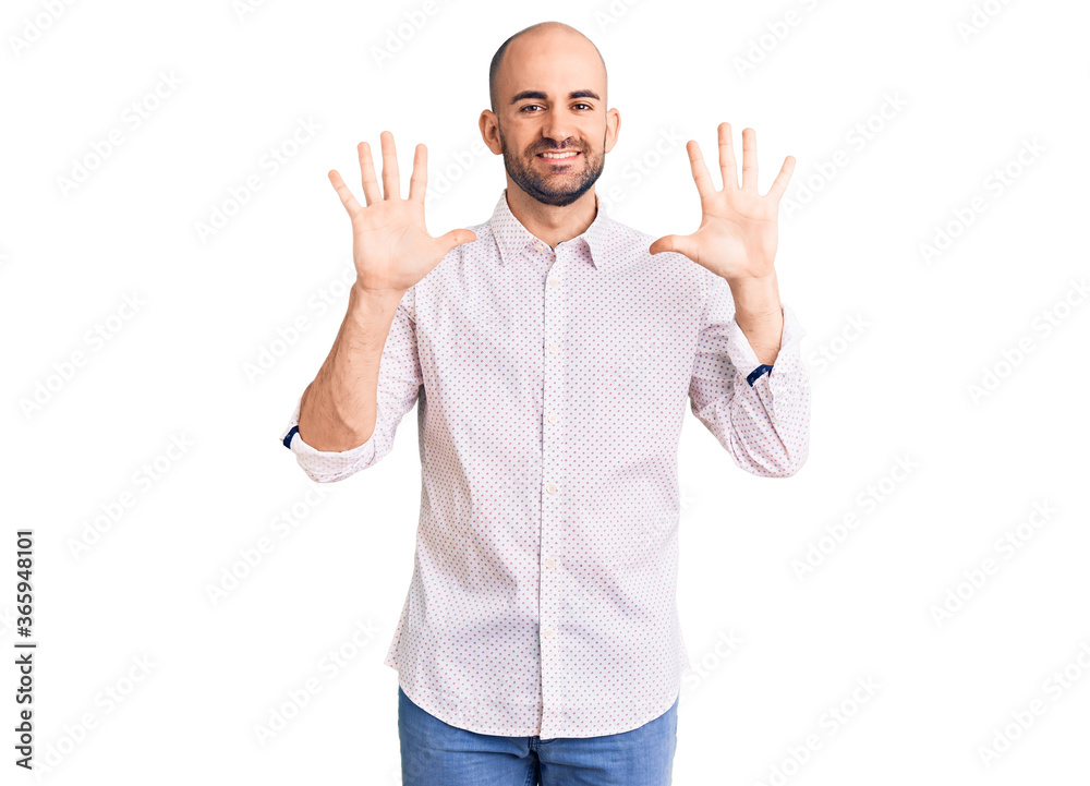Naklejka premium Young handsome man wearing elegant shirt showing and pointing up with fingers number ten while smiling confident and happy.
