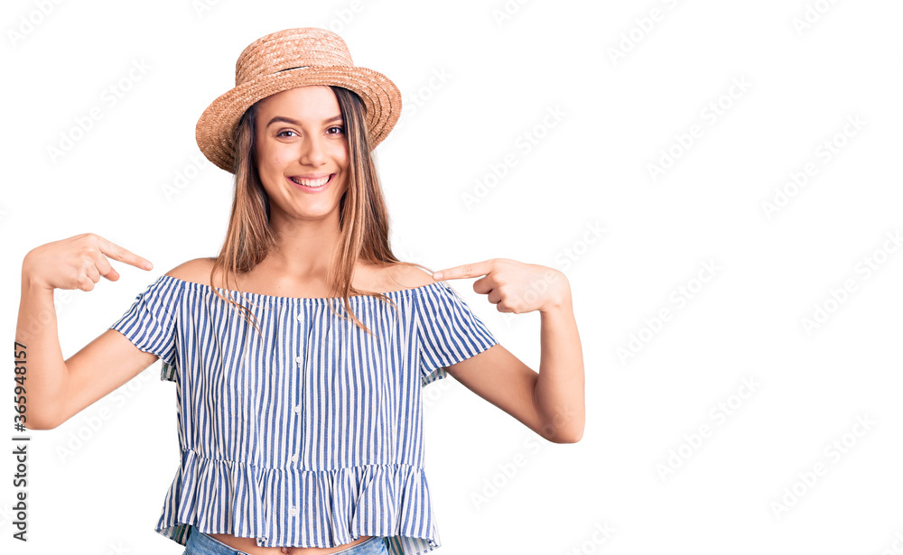 Young beautiful girl wearing hat and t shirt looking confident with smile on face, pointing oneself with fingers proud and happy. Young beautiful girl wearing hat and t shirt looking confident with smile on face, pointing oneself with fingers proud and happy.