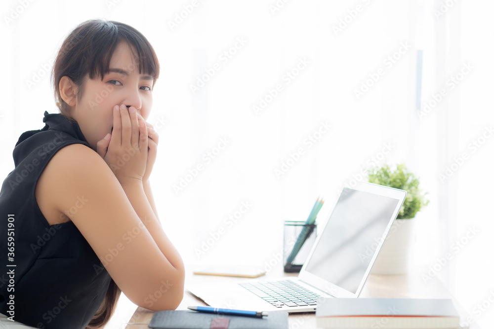 beautiful young freelance asian woman working bored and tired on laptop computer at the office, girl lazy sleepy and yawning on notebook, female secretary with exhausted, business concept. beautiful young freelance asian woman working bored and tired on laptop computer at the office, girl lazy sleepy and yawning on notebook, female secretary with exhausted, business concept.