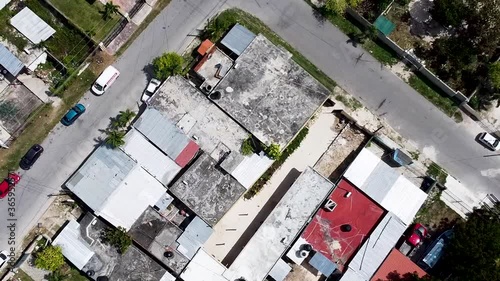 Aerial drone rising and looking straight down onto a small poor neighbourhood in a small town in Quintana Roo, Mexico - Bacalar