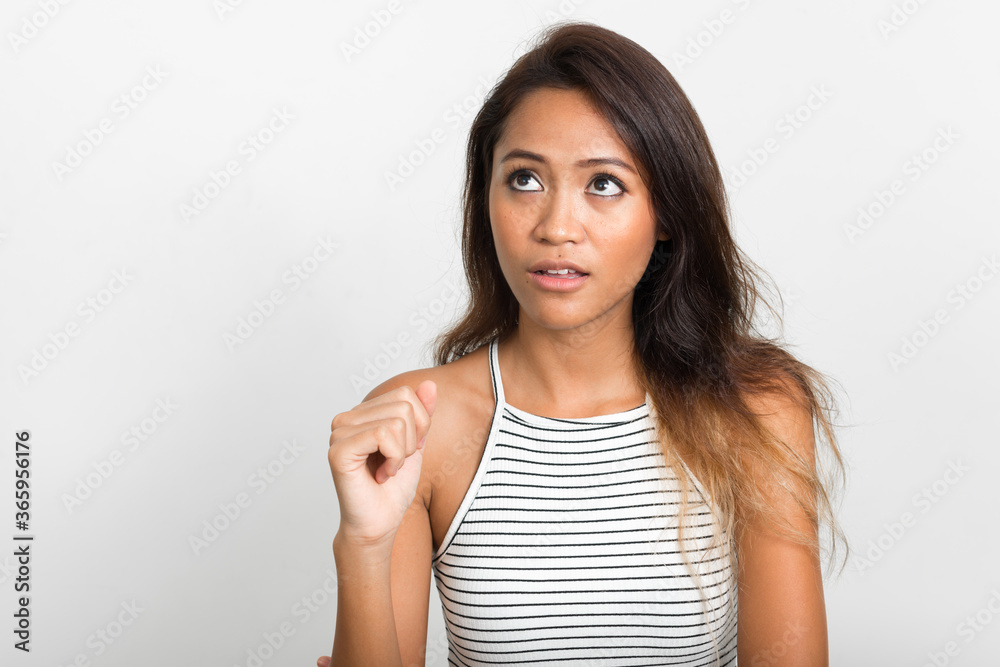 Portrait of young beautiful Asian woman with brown hair Portrait of young beautiful Asian woman with brown hair