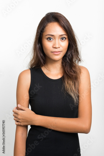 Portrait of young beautiful Asian woman with brown hair