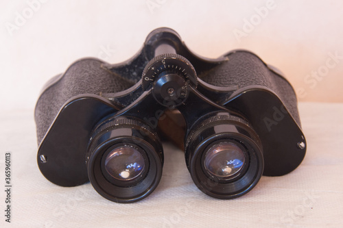 old binocular on a white background.