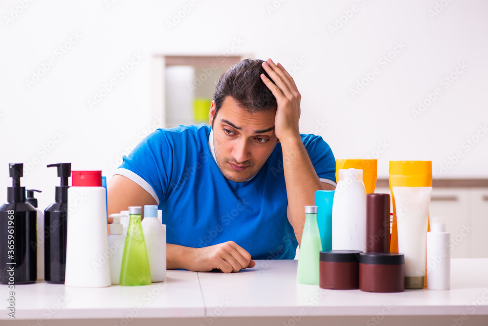 Young man selling cosmetics via internet Young man selling cosmetics via internet