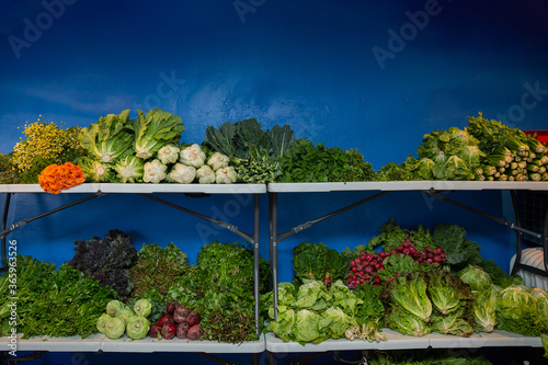 shelves full of vegetables on small local store