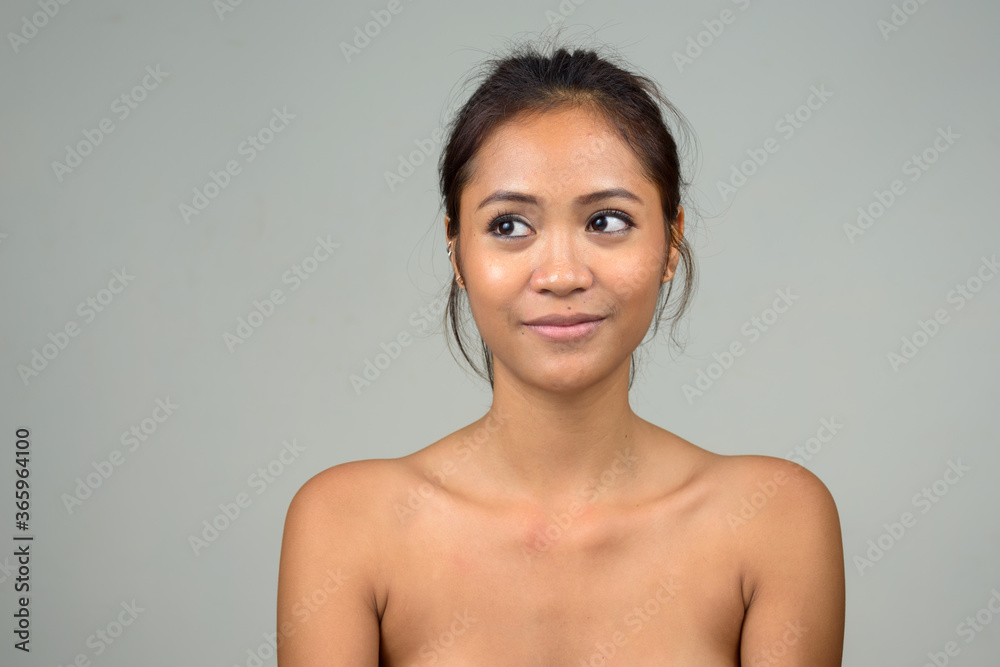 Obraz premium Young beautiful Asian woman shirtless as health and beauty concept