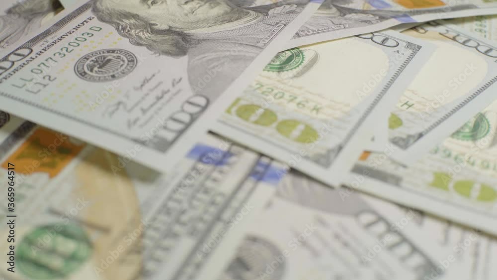 A lot of dollars, close-up. Dollars with a portrait of Franklin A lot of dollars, close-up. Dollars with a portrait of Franklin
