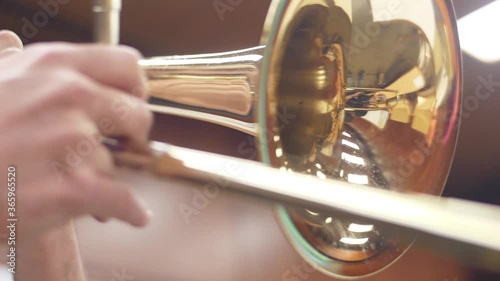 orchestra musician playing trombone slow motion photo