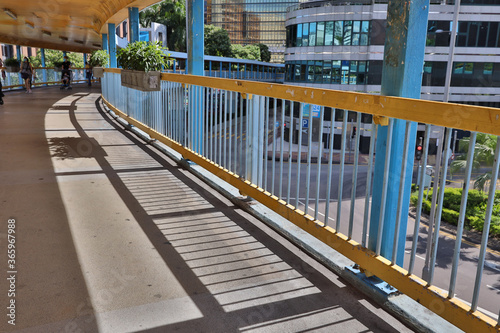 Fotografia, Obraz 18 July 2020 angle view of shadow on footbridge at Hung Hom