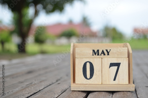 May 7, Number cube with a natural background.