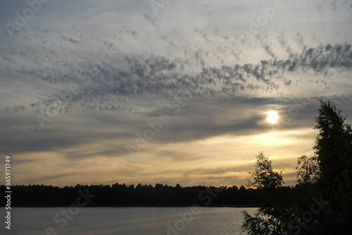 Dramatic and colorful sunset over a forest lake reflected in the water. Blakheide, Beerse, Belgium. High quality photo