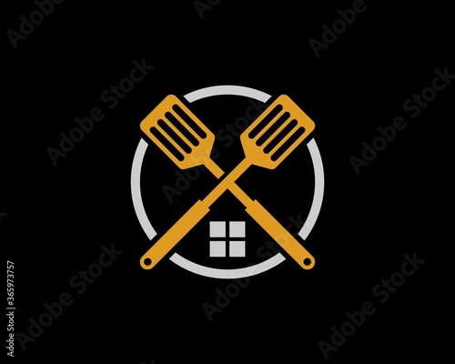 Golden spatula crossed with window in the circle