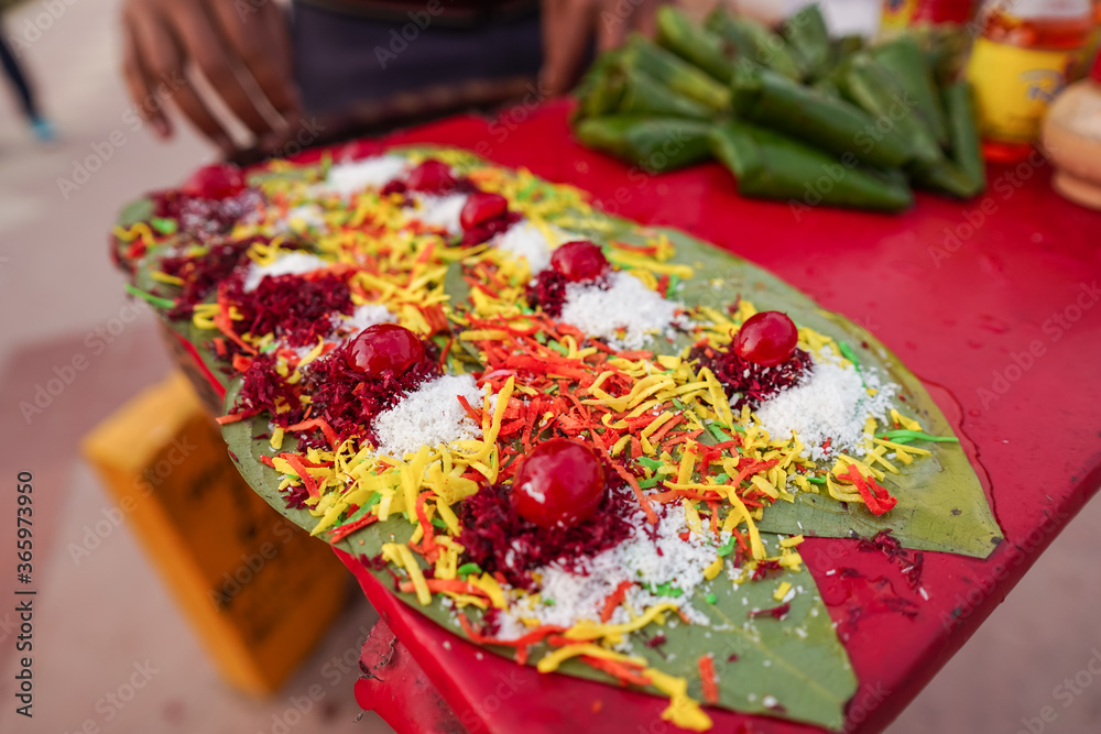 Colorful snack served in leaves sold by street seller near India Gate
