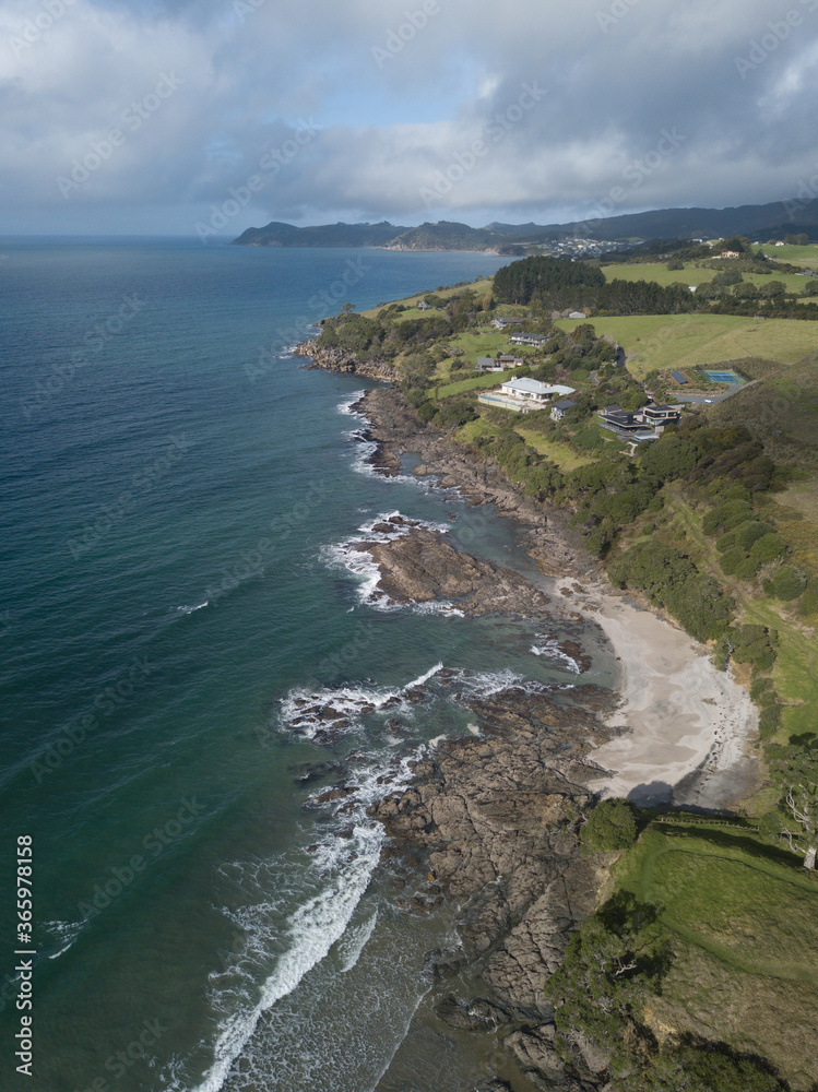 Aerial photo of small waves breaking. Taken off the coast of a small surf town in beautiful New Zealand. Aerial photo of small waves breaking. Taken off the coast of a small surf town in beautiful New Zealand.