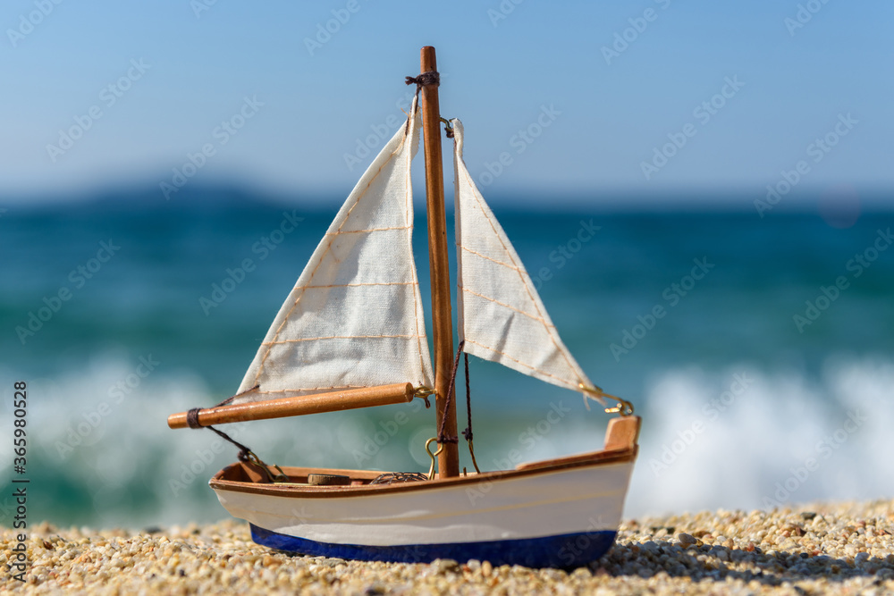 Miniature fishing boat at beach Stock Photo