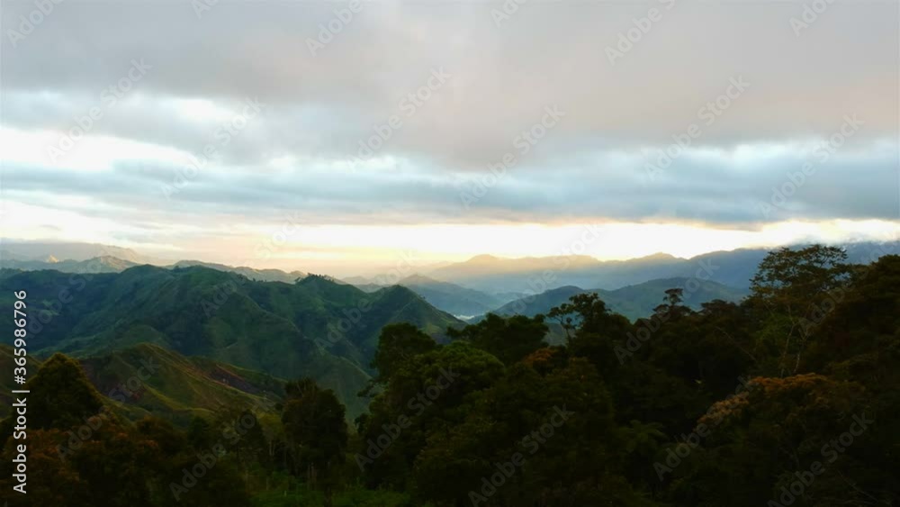 Drone shot of mountains with rain forest foreground during sunset Drone shot of mountains with rain forest foreground during sunset