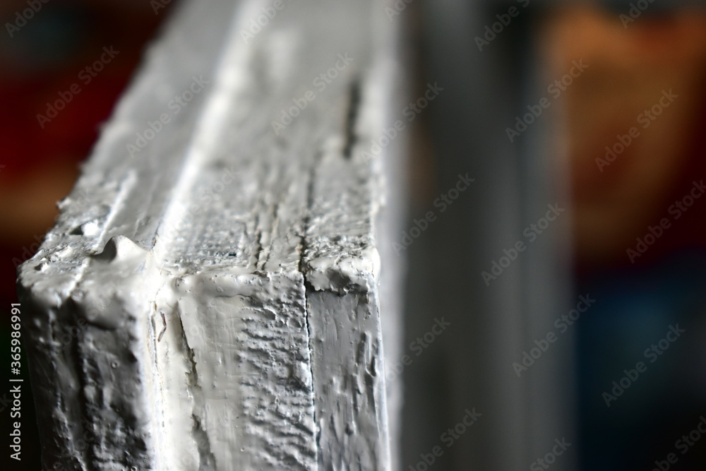 Part of an old wooden window frame. Close up view. Part of an old wooden window frame. Close up view.
