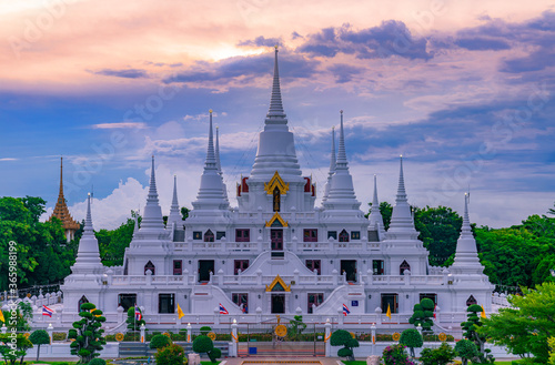  White Buddhist Pagoda with multiple spires at Wat Asokaram Temple in Samutprakan province, Thailand photo