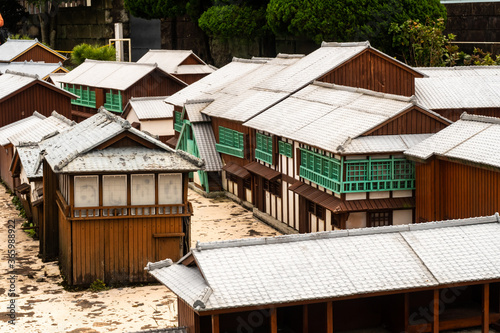 Nagasaki, Japan, 03/11/19. Scale model of a Dutch trading post on display in Dejima, former artificial island in the harbor in Nagasaki, close-up view of wooden old buildings.
O photo