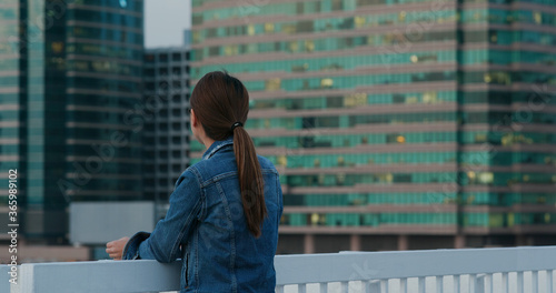 Photography Woman looks at city view