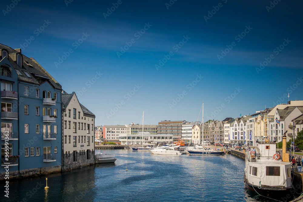 Fototapeta premium Alesund. Norwegian port city. Northern Europe. Streets and houses on the water