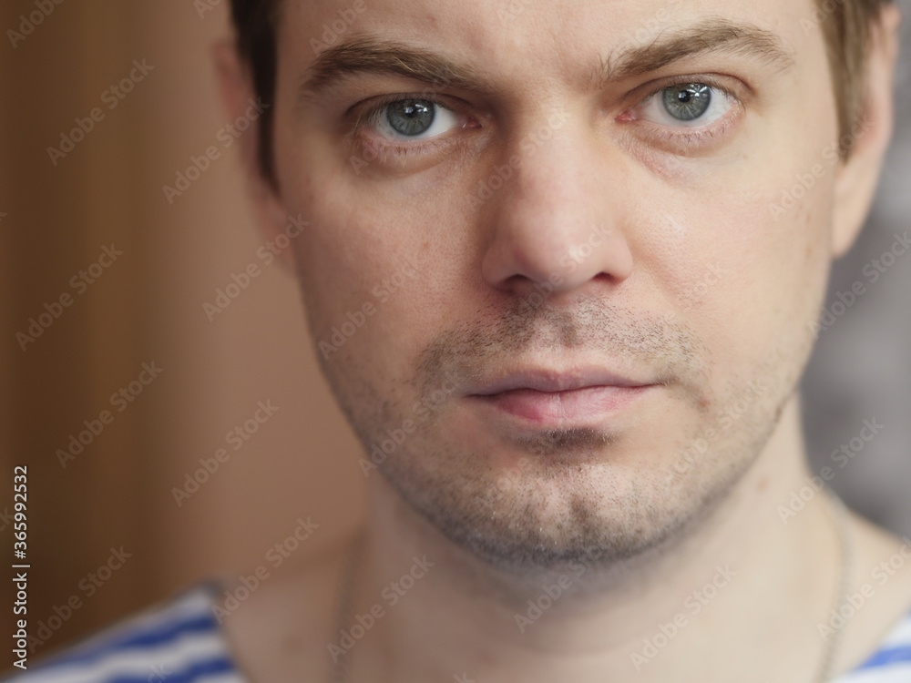 Fototapeta premium Portrait of pensive man with short hair and no retouch.