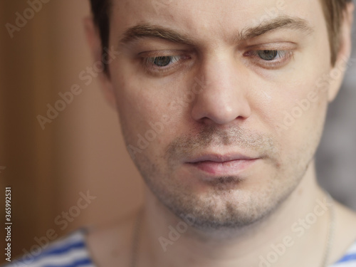 Portrait of pensive man with short hair and no retouch.