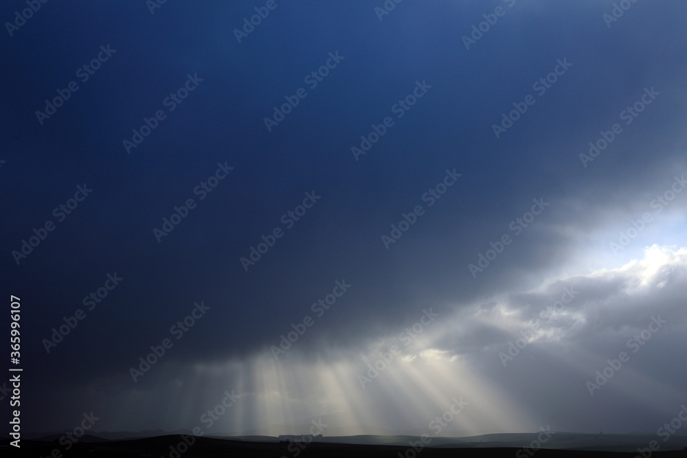 Bright sunlight breaks through the cloudscape Bright sunlight breaks through the cloudscape