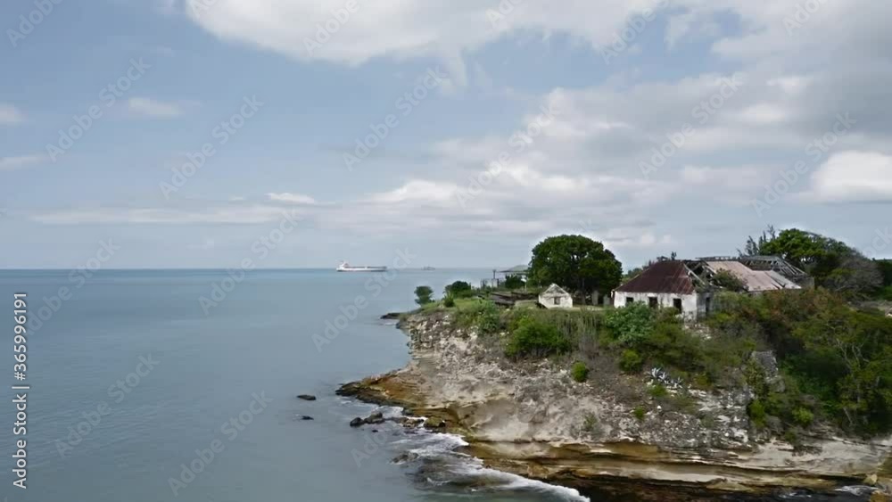 Drone quickly flies around the island with Fort James ruins, A liner is visible on the horizon (St. John's, Antigua and Barbuda) Drone quickly flies around the island with Fort James ruins, A liner is visible on the horizon (St. John's, Antigua and Barbuda)