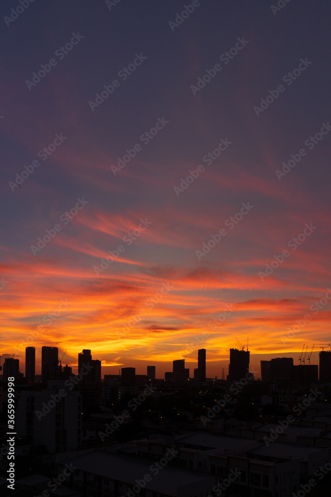 Silhouette of skyscraper city landscape background with beautiful sunset sky.