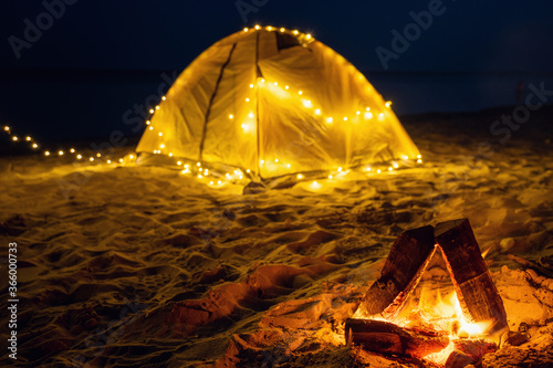 The fire at night on the beach. Summer mood