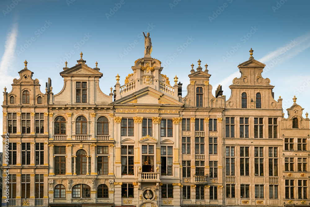 Sunset in Grand Place Market of Brussels in Belgium with blue sky and warm light