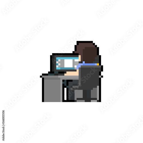 Pixel art man character working at computer desk.