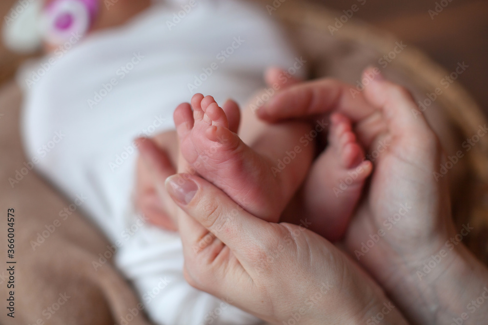 Newborn baby feet in father hands. Family concept. Props for little baby photoshoot. Newborn baby feet in father hands. Family concept. Props for little baby photoshoot.