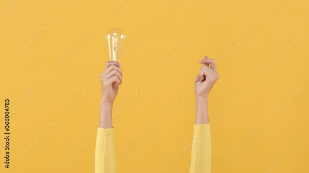 Woman hand doing finger snapping to turn on light bulb for creative and idea generation concepts 