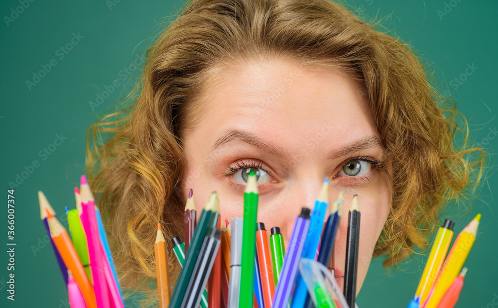 September 1. Pen. Pencils. Education. School. Job. Teacher in classroom. Back to school. Funny teacher. School supplies. Close up portrait of teacher. September 1. Pen. Pencils. Education. School. Job. Teacher in classroom. Back to school. Funny teacher. School supplies. Close up portrait of teacher.