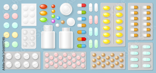 Blisters with medical pills and capsules. Top view. Packaging for drugs: antibiotics, painkillers, vitamins and aspirin tablets. View from above.