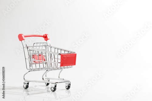 Cart is empty from the supermarket on a white background. Online shopping for buyers concept. © GooMmnutt