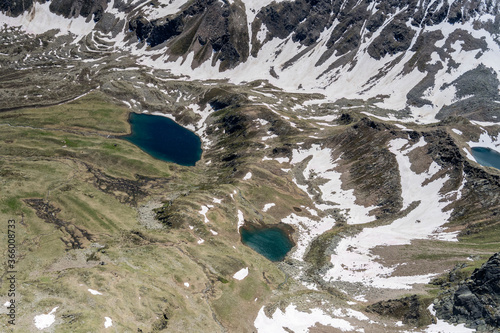 little lakes in high Grosina valley in  late spring, Alps, Italy photo